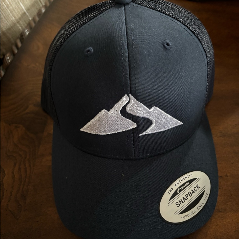 Black Trucker Snapback Hat with White Mountain Logo
